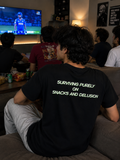 Surviving purely on snacks and delusion t shirt
